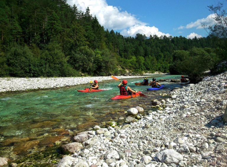 kayakers enjoy calm waters with a river guide